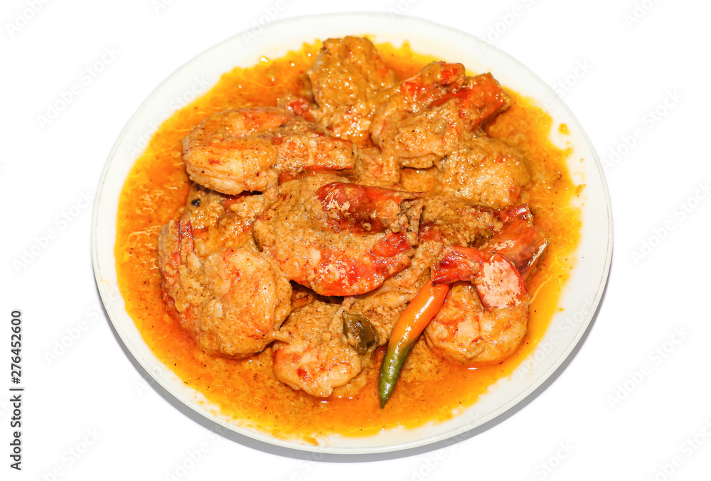 Indian spicy food shrimp curry prepared with coconut served as side dish with rice isolated on white background Indian spicy food shrimp curry prepared with coconut served as side dish with rice isolated on white background