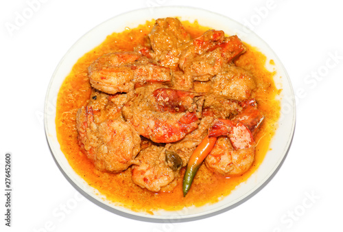 Indian spicy food shrimp curry prepared with coconut served as side dish with rice isolated on white background