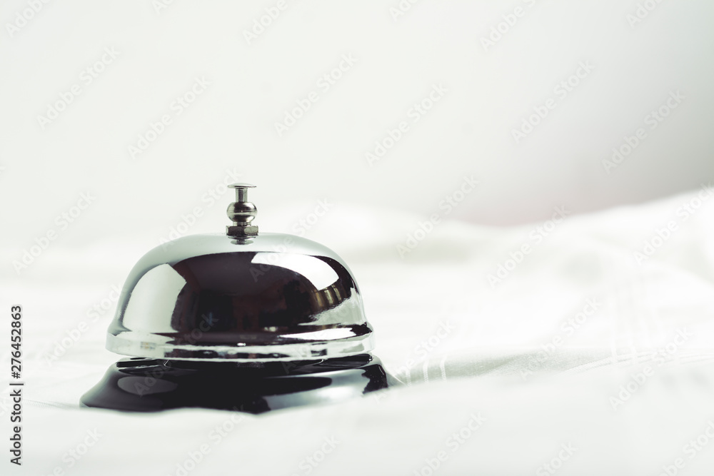 Service concept. Silver reception bell on white background making it vintage color tone