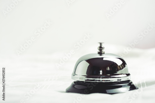 Service concept. Silver reception bell on white background making it vintage color tone