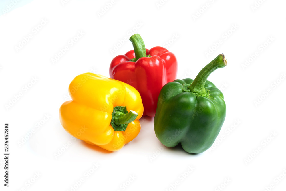 Fresh three color sweet peppers isolated on white background