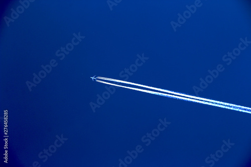 Minimalist Airplane with Contrail