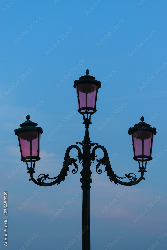 Pink street lantern in Venice, Italy
