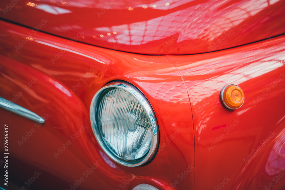 Vintage red car with bag on back close up