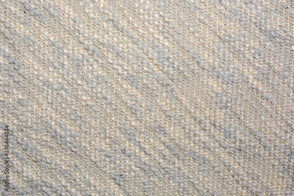 The texture of the knitted gray fabric for the background The texture of the knitted gray fabric for the background