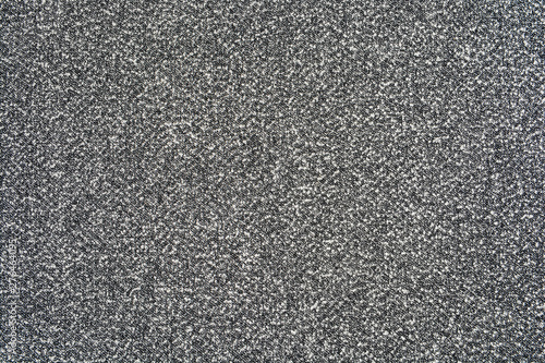 The texture of the knitted gray fabric for the background 