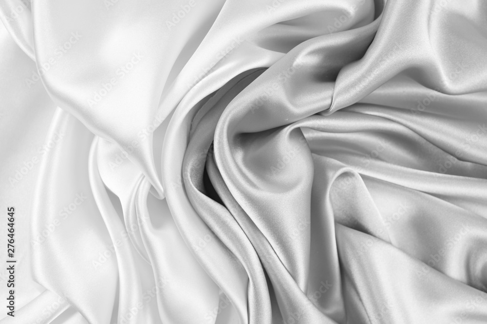 Fototapeta premium The texture of the satin fabric of white color for the background