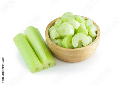 Fresh celery vegetable in wood bowl and sliced  isolated on white background, food for health