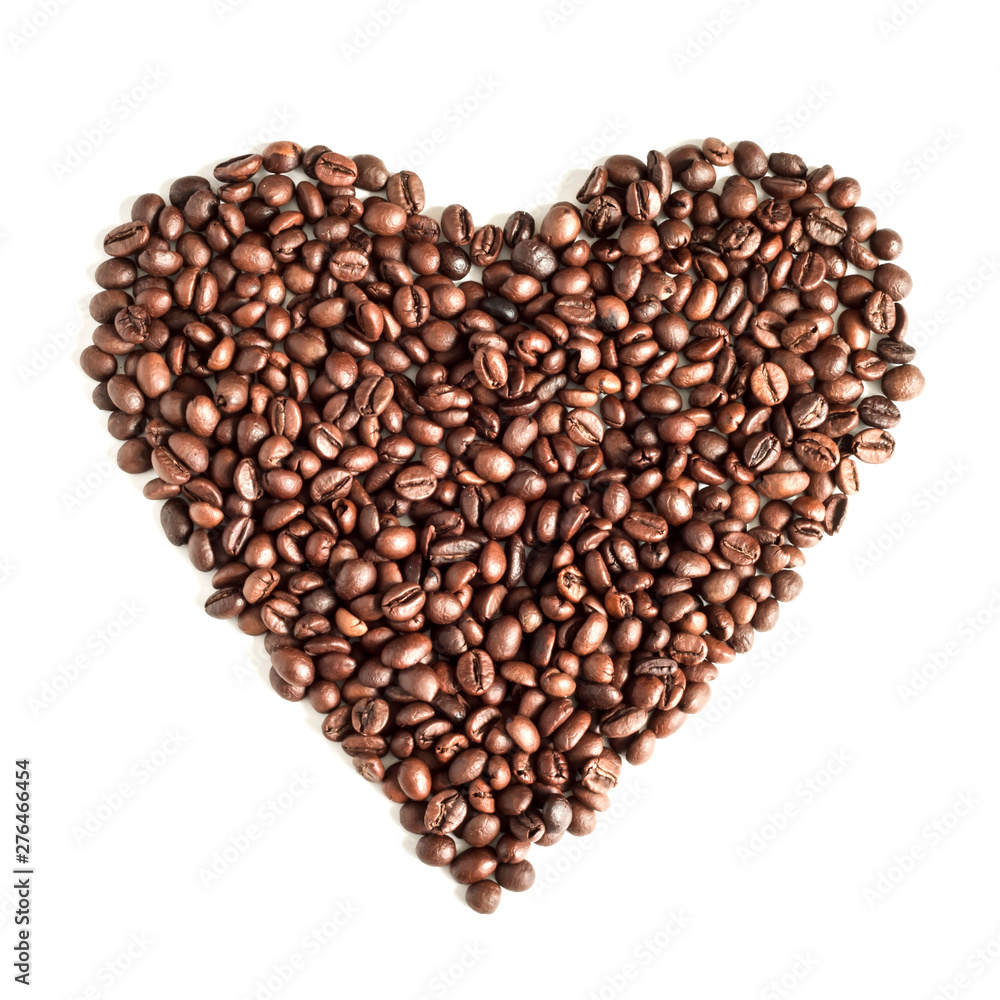 Coffee grains isolated on white background top view. Coffee time concept. Coffee beans on a white background scattered in the shape of a heart Coffee grains isolated on white background top view. Coffee time concept. Coffee beans on a white background scattered in the shape of a heart