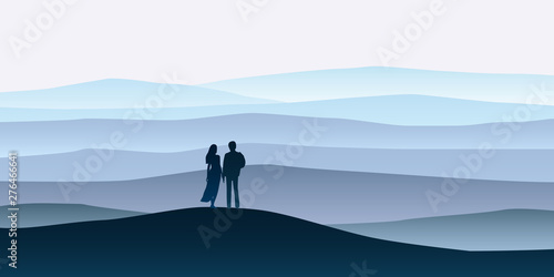 Loving couple silhouette , a man and a woman are looking at the new year goals