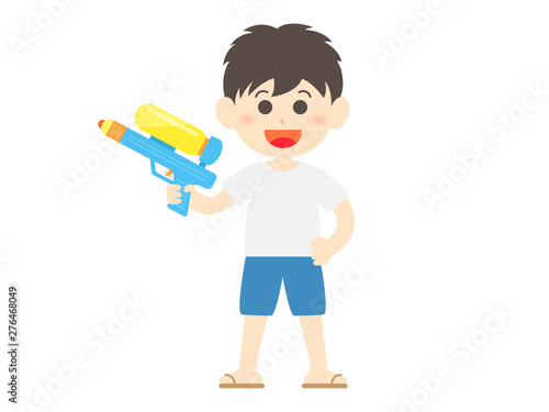 水鉄砲で遊ぶ少年