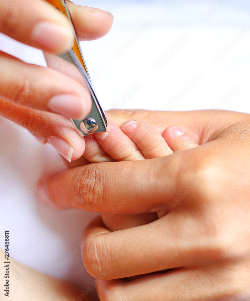 Close-up of mother cutting babies nails. Close-up of mother cutting babies nails.