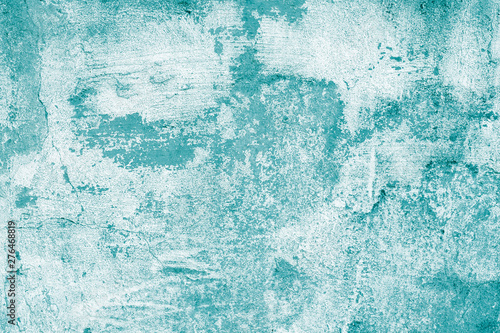 Turquoise shabby concrete wall with flaky plaster. Torn rough old texture. Vintage, cracked distressed background. Abstract green pattern. Virid paint stains on white canvas. Creative illustration 