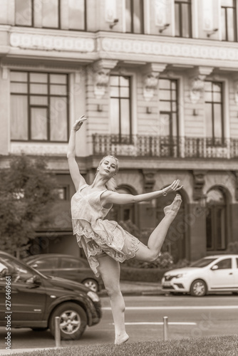 A gorgeous european young woman ballet dancer in city, inspiration for other people. Looks like princess have grace and body plastic dancing on outdoors © T.Den_Team
