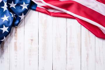 Top view of Flag of the United States of America on white wooden background. Independence Day USA, Memorial.