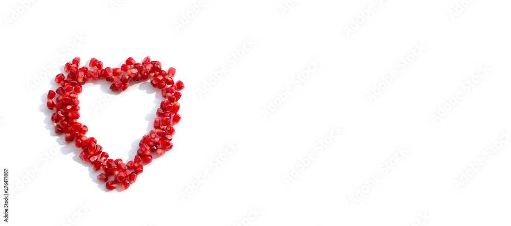 pomegranate seeds scattered in the shape of a heart pomegranate seeds scattered in the shape of a heart