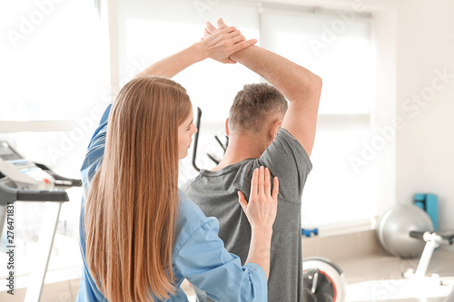 Physiotherapist working wit...