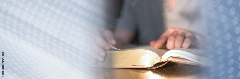Man reading the bible; panoramic banner - obrazy, fototapety, plakaty 