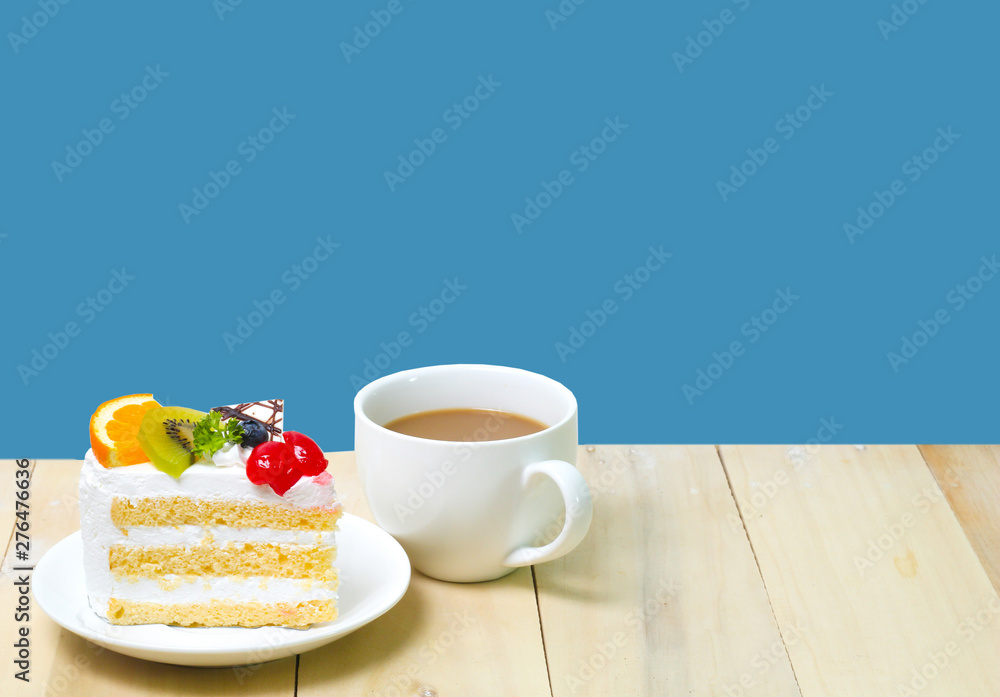 Slice cake with coffee cup on wood , blue background Slice cake with coffee cup on wood , blue background
