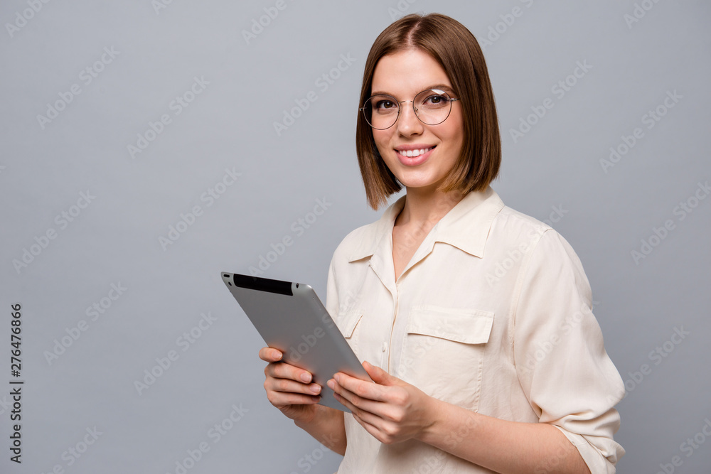 Close up side profile photo beautiful attractive she her business lady chief e-reader hands arms reader data startup novelty interested curious wear specs casual white shirt isolated grey background Close up side profile photo beautiful attractive she her business lady chief e-reader hands arms reader data startup novelty interested curious wear specs casual white shirt isolated grey background