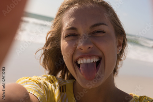 Woman having fun at beach on a sunny day