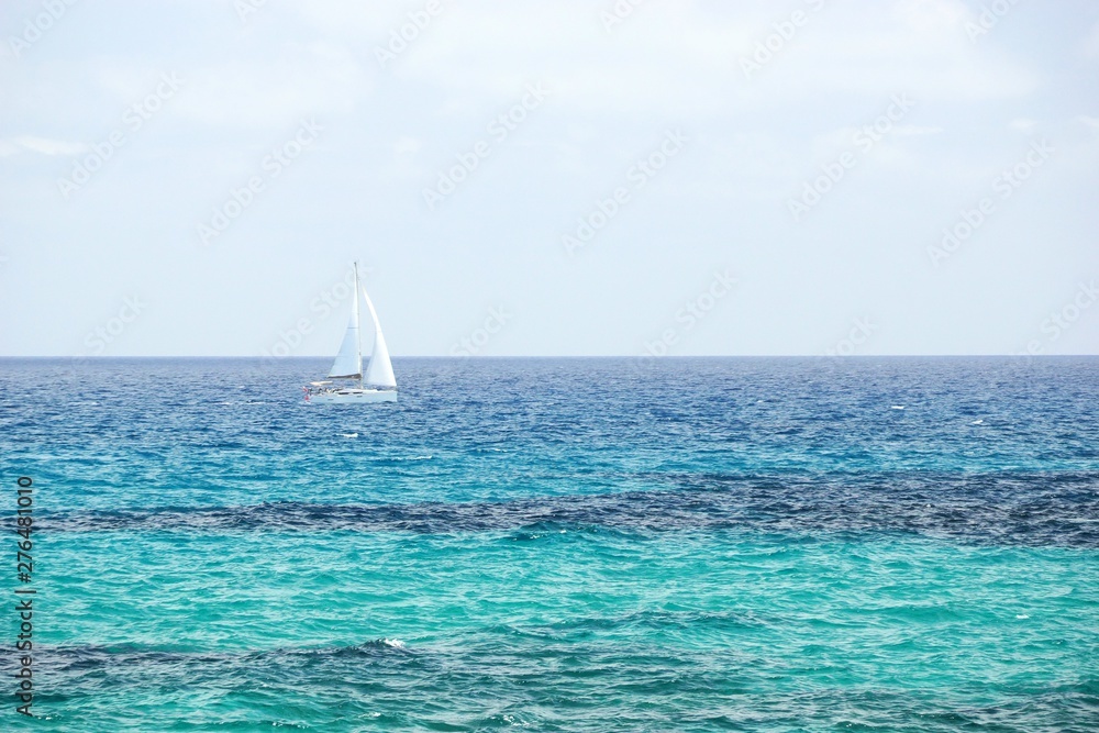 Racing yacht in the Mediterranean sea on sky background
