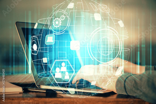 Social network theme hologram with businessman working on computer on background. Concept of world wide web. Multi exposure.