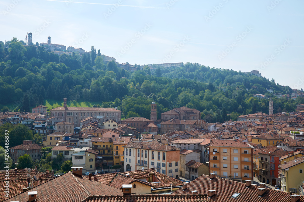 Mondovi town rooftops and hill in summer in Piedmont, Italy