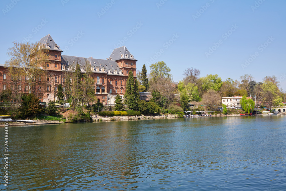 Valentino castle and Po river bank, clear blue sky in Piedmont, Turin, Italy