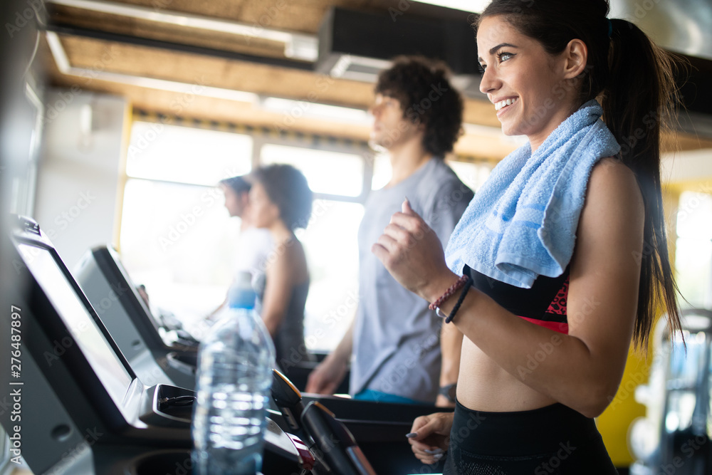 Group of sportive people in a gym training Group of sportive people in a gym training
