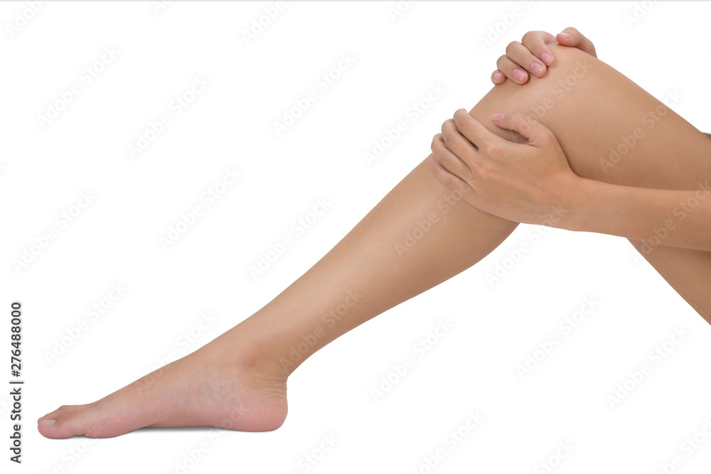 Woman holding her leg with massaging knee in pain area isolated on white background
