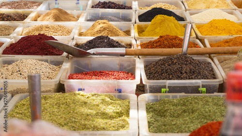 Various spices for sale in the bazaar. Close image of volorful spices in the boxes. photo