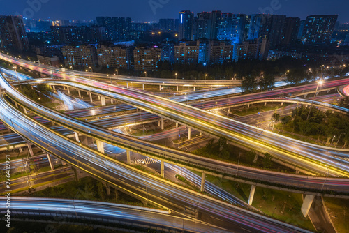 Large interchange with busy traffic aerial view at night in Chengdu, China © LP2Studio