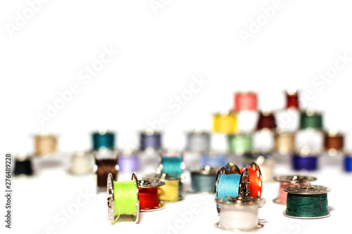 Spools of thread on a white background. For sewing