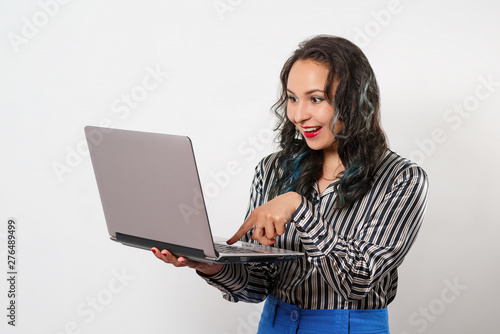 stylish young woman in blouse, with a laptop in her hands. on white background