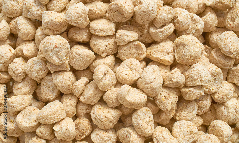 Background texture of crushed seed and grain mix for livestock and bird feed Background texture of crushed seed and grain mix for livestock and bird feed