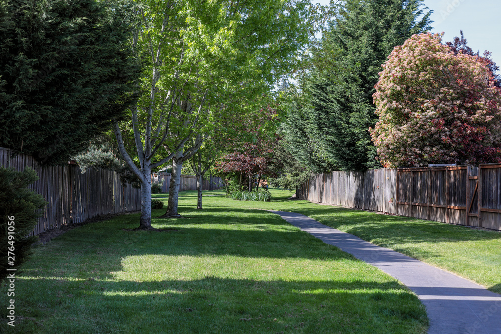 An empty walkway between wooden fences in a neighborhood, Hillsboro, Oregon