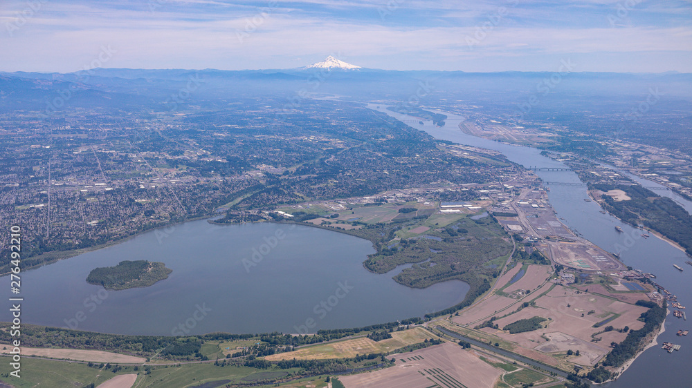 Obraz premium Aerial view at city of Vancouver, Columbia river, Portland International Airport, Vancouver Park and Lake, Hayden Island with Mt Hood in the background