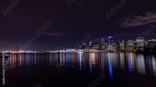 Vancouver, BC \ Canada - 13 March 2019: Vancouver skyline at night. Long exposure photo of city downtown and a harbor. © Dmitry