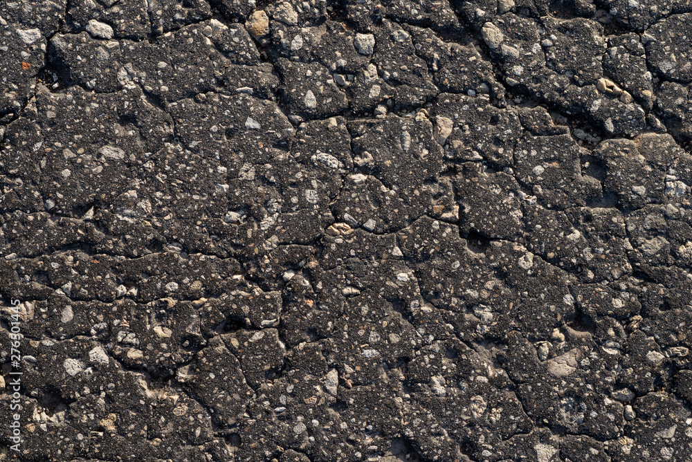 Macro texture of old cracked asphalt