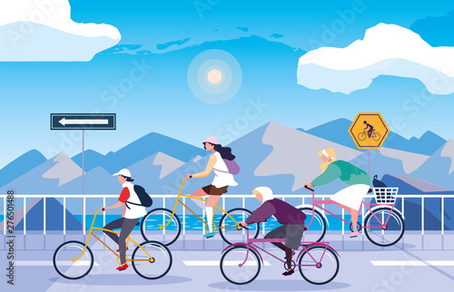 people riding bike in snowscape with signage for cyclist