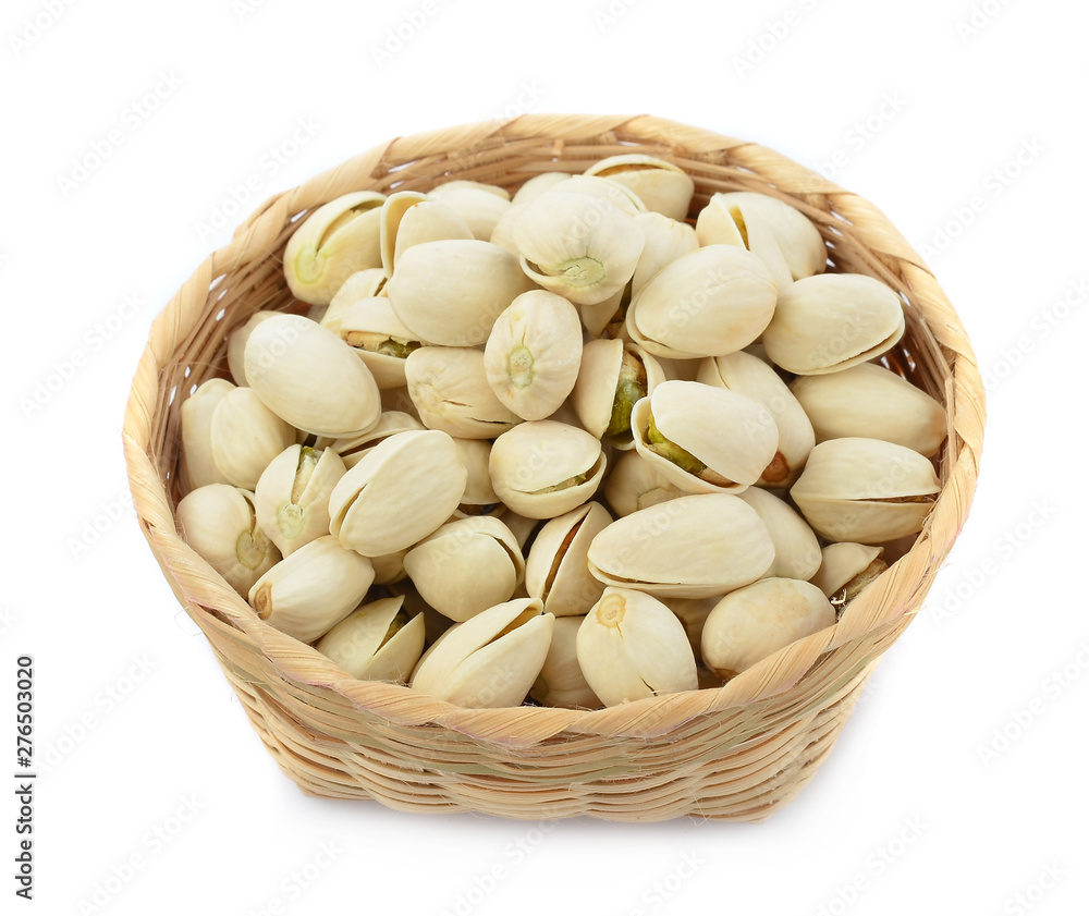 Pistachios with in the wooden bowl isolated on white background Pistachios with in the wooden bowl isolated on white background