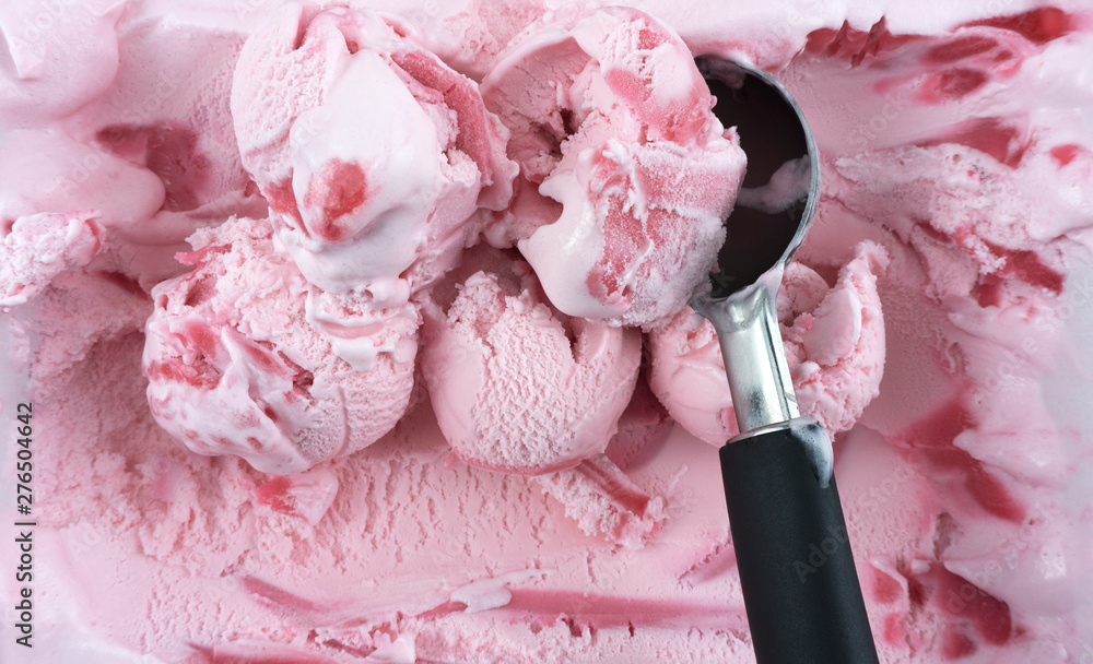 Fototapeta Scooping Strawberry ice cream with a spoon, Closeup Top view, Blank for design..