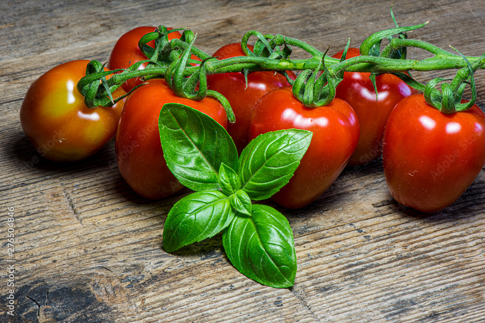 Fresh tomatoes on wood background Fresh tomatoes on wood background