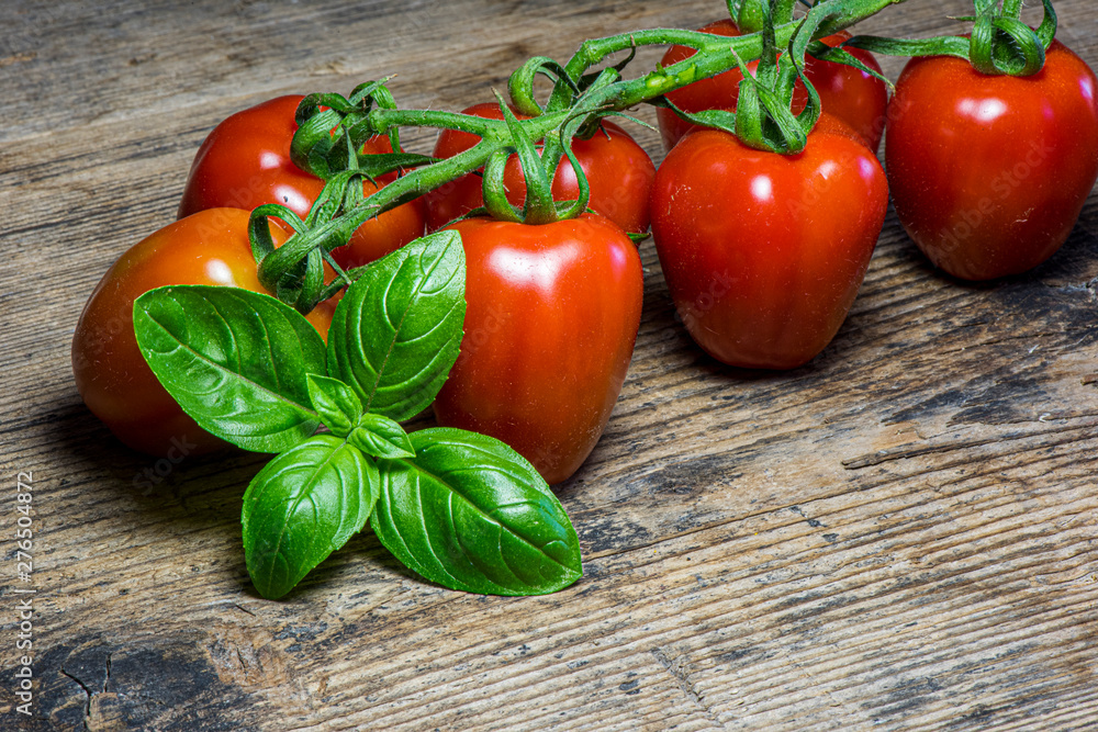 Fresh tomatoes on wood background Fresh tomatoes on wood background