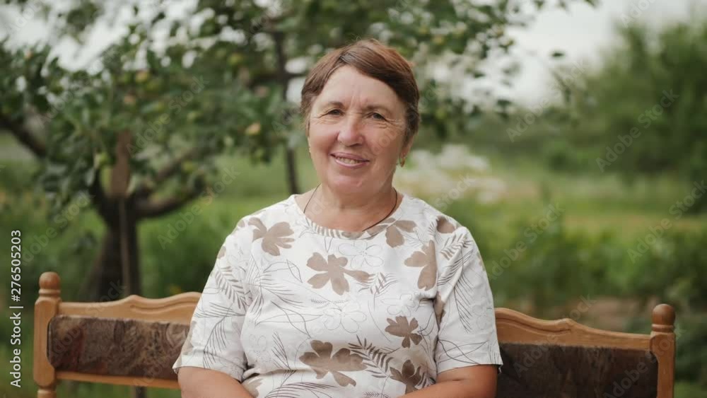 Portrait of an elderly brunette woman outdoors Portrait of an elderly brunette woman outdoors