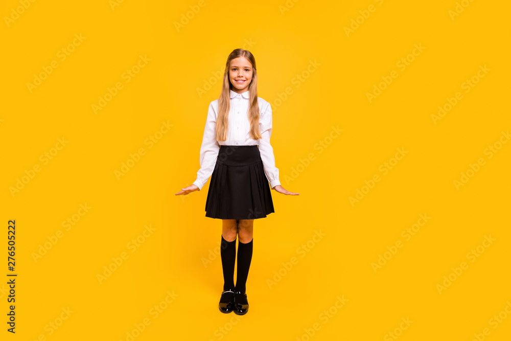 Full length body size view of her she nice attractive lovely content cheerful cheery straight-haired pre-teen girl posing standing straight isolated over bright vivid shine yellow background