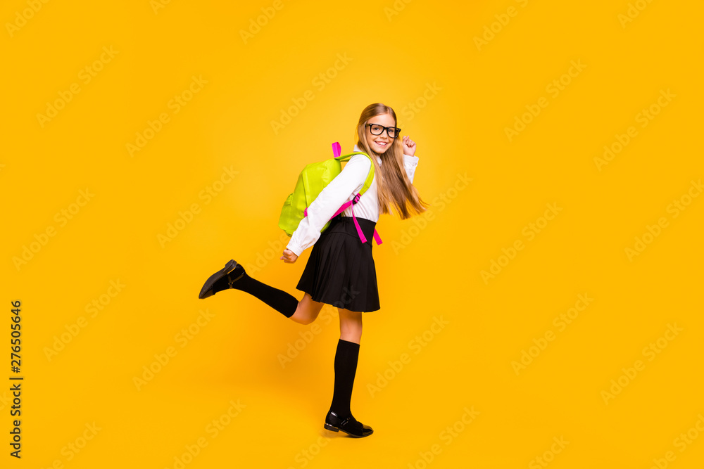 Full length body size view of her she nice attractive cheerful cheery glad straight-haired pre-teen girl having fun going to first grade isolated on bright vivid shine yellow background Full length body size view of her she nice attractive cheerful cheery glad straight-haired pre-teen girl having fun going to first grade isolated on bright vivid shine yellow background