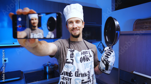 Cooking influencer shooting a video with smartphone photo