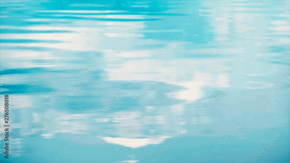 Calm watersurface with smooth waves rolling on it Calm watersurface with smooth waves rolling on it